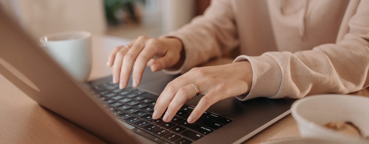 Woman typing on computer